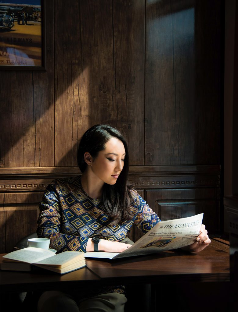 business woman reading in cafe